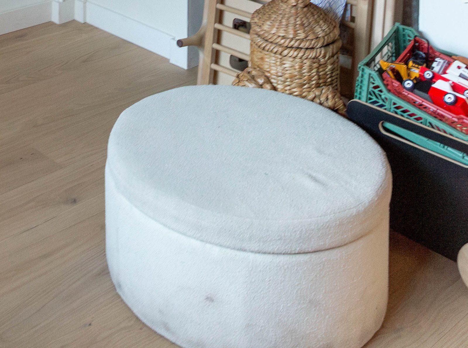 before photo of old round ottoman in dirty fabric