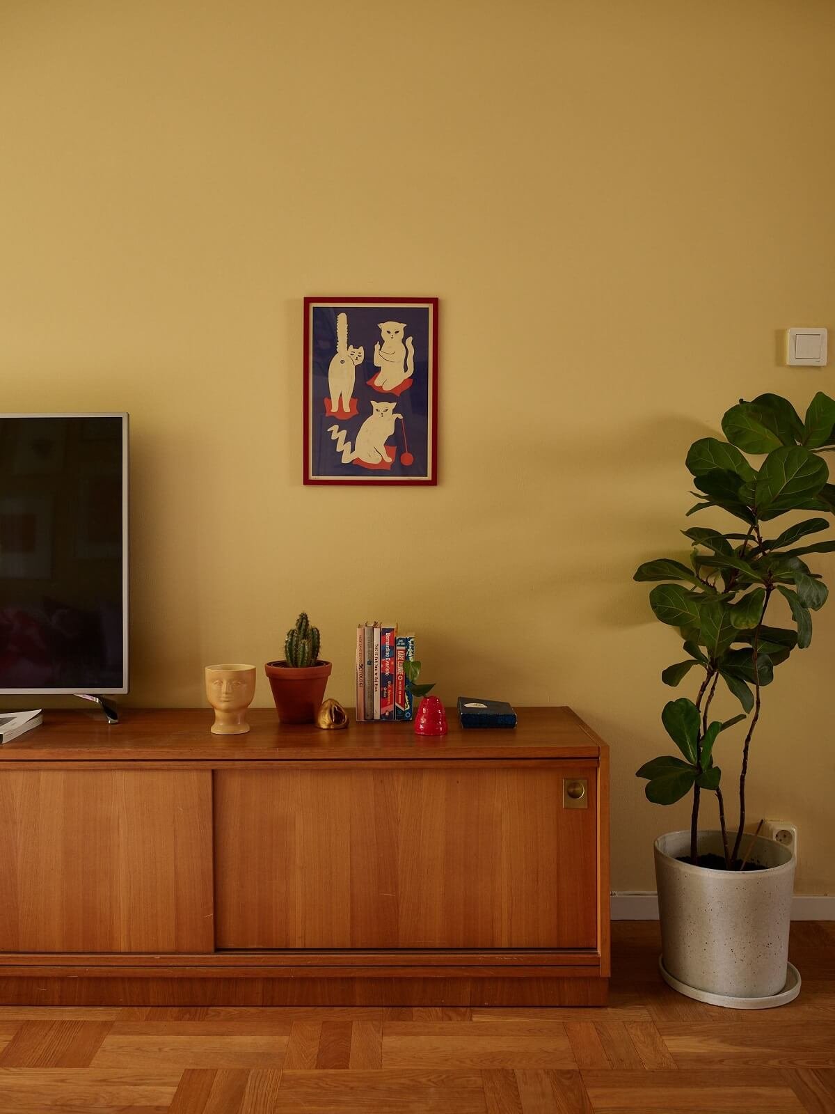 butter yellow walls in minimal midcentury living room