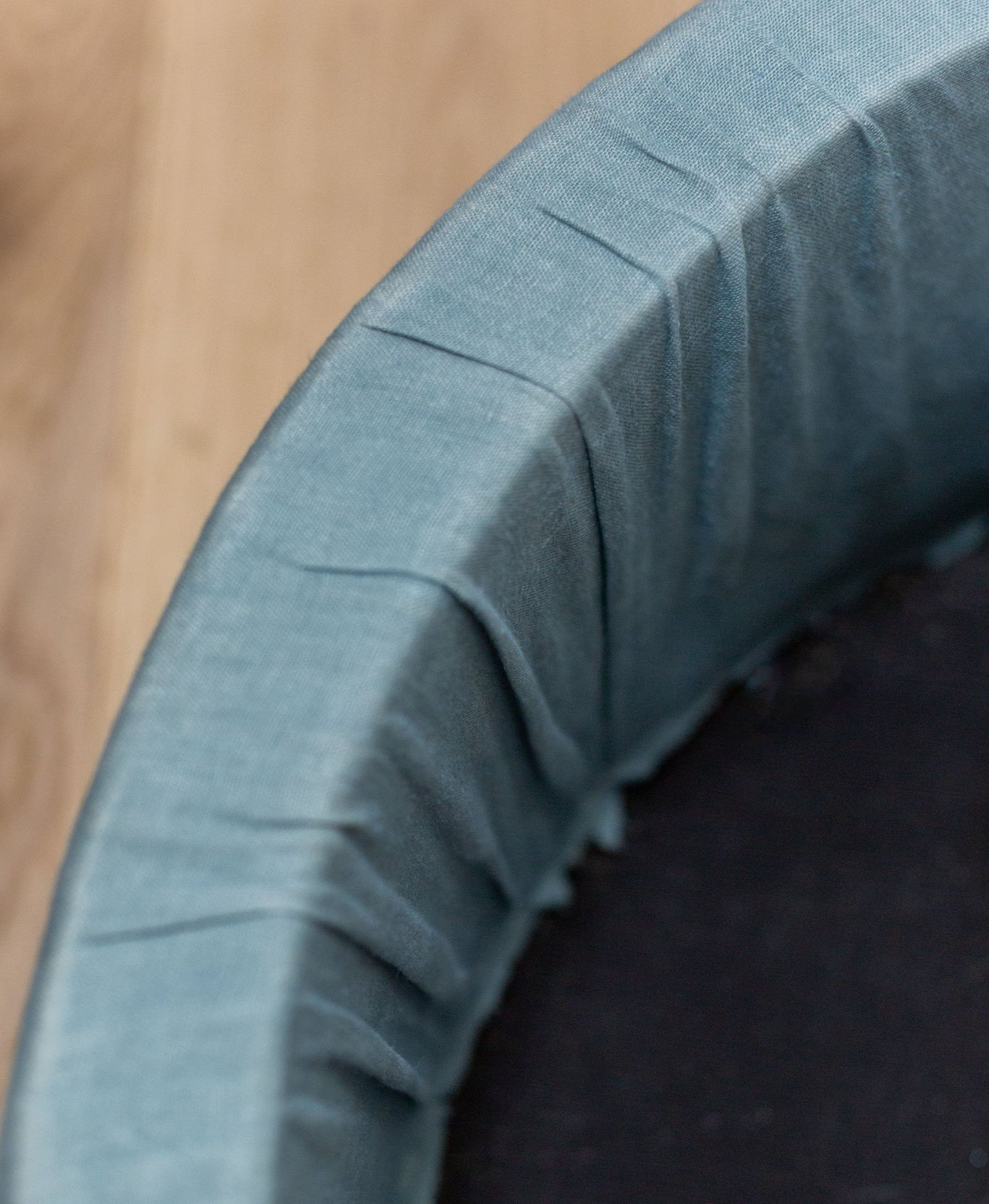 instructions for reupholstering a round ottoman in blue fabric
