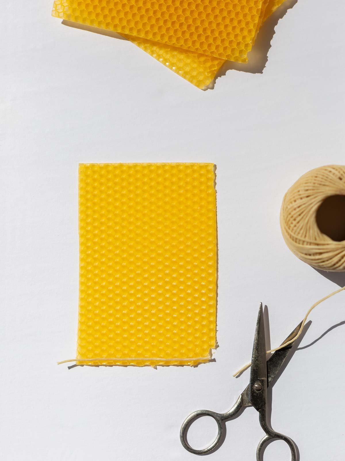 materials laid out to make rolled beeswax candles