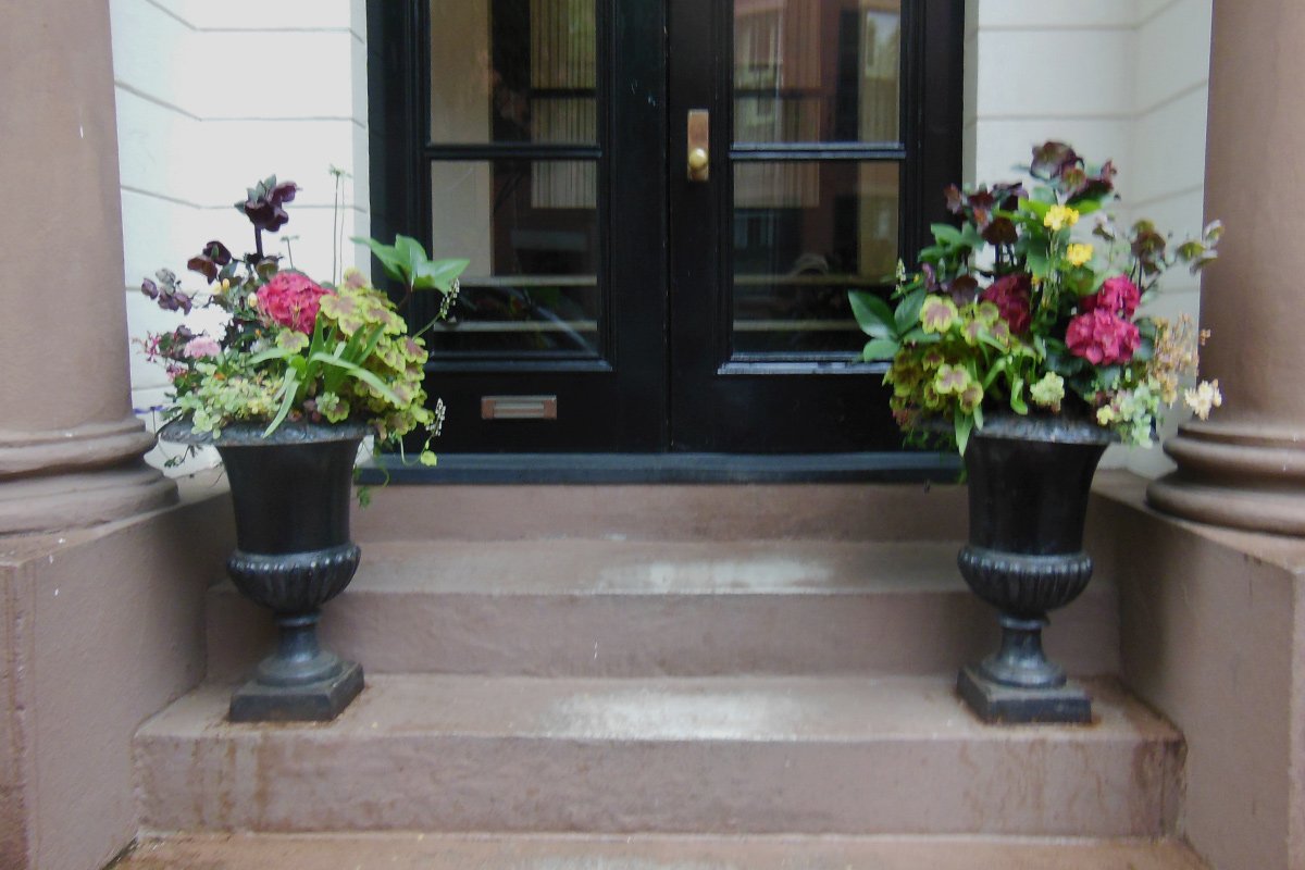 matching entryway containers with colorful foliage