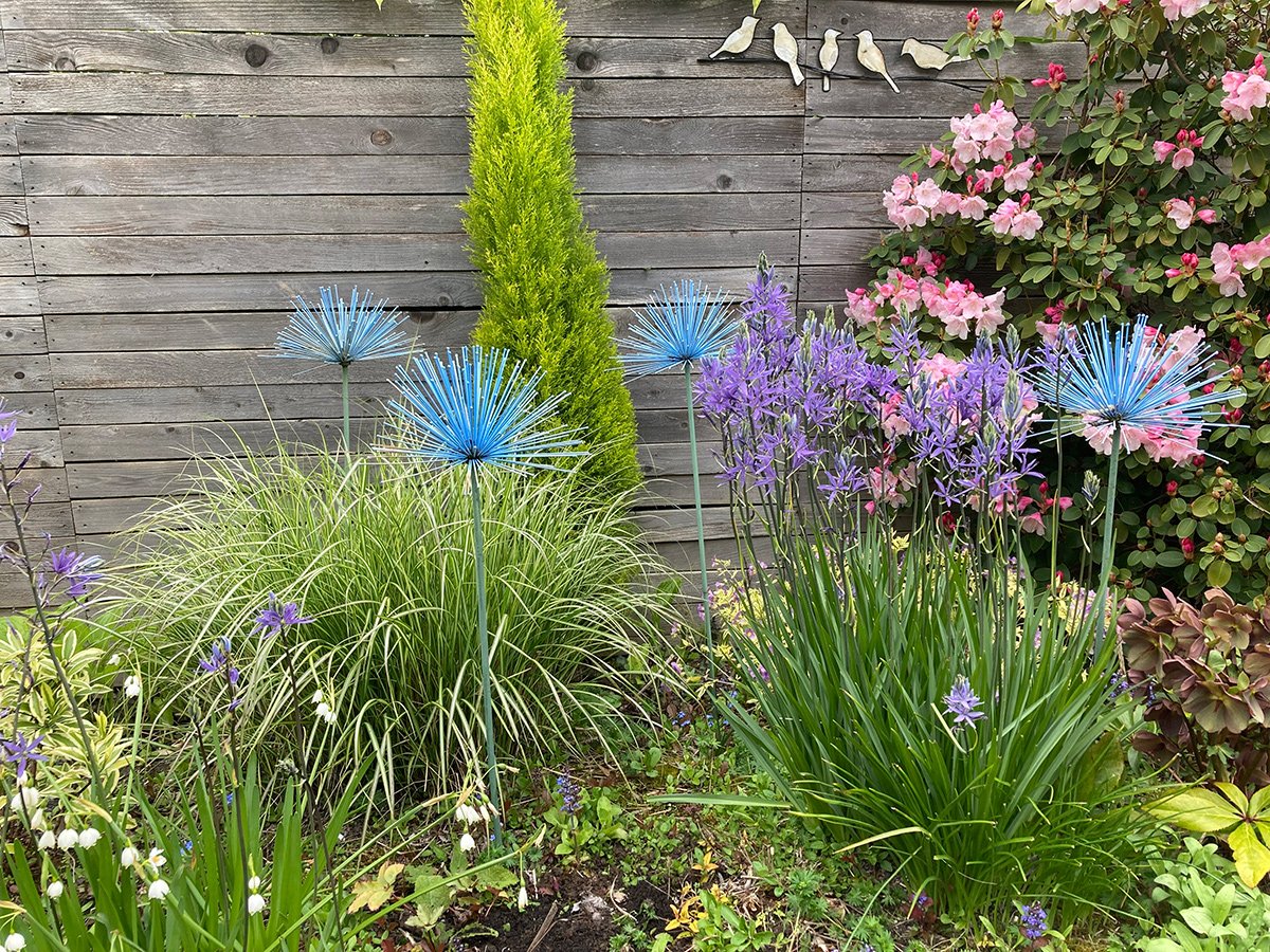flower garden with blue metal flower sculptures